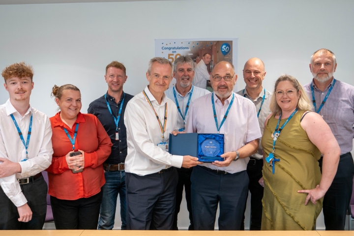 1-Roger-Gembis-50-years-with-colleagues-scaled.jpg